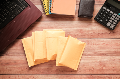 yellow-paper-bubble-envelope-on-table-2022-10-04-00-13-25-utc
